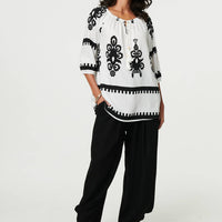 Ikat Print Tassel Tie Neck Blouse