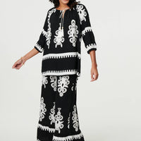 Ikat Print Tassel Tie Neck Blouse