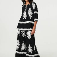 Ikat Print Tassel Tie Neck Blouse