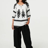 Ikat Print Tassel Tie Neck Blouse